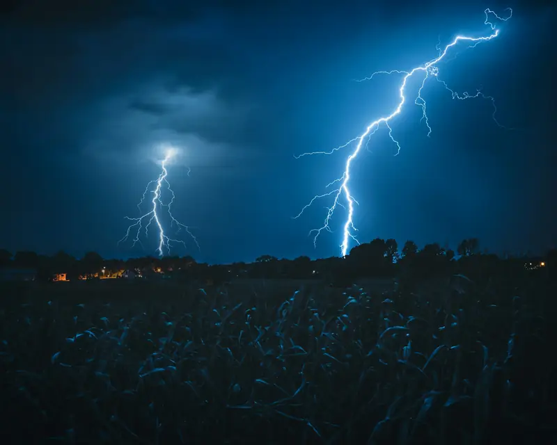 Lightning over an open field at night